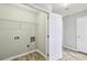 Practical laundry area with vinyl flooring, shelving, and hookups at 1559 Hillary Cove Ct, Lawrenceville, GA 30043