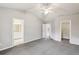 Spacious main bedroom with neutral paint, carpet, ensuite bath, and walk-in closet at 1559 Hillary Cove Ct, Lawrenceville, GA 30043