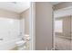 Bathroom featuring a shower/tub combo and a toilet at 305 Long Creek Dr, Covington, GA 30016