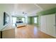 Spacious bedroom features light green walls, recessed ceiling, and large windows for natural light at 3170 Wood Springs Sw Trce, Lilburn, GA 30047