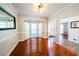 Charming dining room featuring hardwood floors, natural light from a bay window, and elegant trim detailing at 3170 Wood Springs Sw Trce, Lilburn, GA 30047