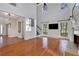 Bright living room featuring hardwood floors, fireplace, high ceilings, and natural light at 3170 Wood Springs Sw Trce, Lilburn, GA 30047