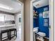 View of the Kitchen with a bright blue decorated powder room at 5998 Graywood Se Cir, Mableton, GA 30126