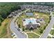 Aerial view of the community pool, tennis courts, playground, clubhouse, and surrounding homes at 145 Meadow Branch Ln, Dallas, GA 30157