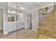Bathroom showcasing tile flooring, double vanity sinks, and walk-in shower with bench at 145 Meadow Branch Ln, Dallas, GA 30157