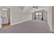 Spacious bedroom featuring neutral walls, carpet flooring, ceiling fan, and a door to the bathroom at 145 Meadow Branch Ln, Dallas, GA 30157