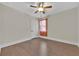Bedroom featuring hardwood floors, ceiling fan, and window at 145 Meadow Branch Ln, Dallas, GA 30157