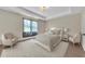 Bedroom showcasing a tray ceiling, a large window, and neutral decor at 145 Meadow Branch Ln, Dallas, GA 30157