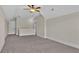 Large carpeted bonus room provides versatile space, with a ceiling fan and plenty of natural light at 145 Meadow Branch Ln, Dallas, GA 30157