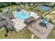 Aerial view showcasing the pool, clubhouse, tennis court, and playground creating an active lifestyle community at 145 Meadow Branch Ln, Dallas, GA 30157