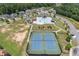 Aerial view showcasing the tennis courts, pool and playground in the community at 145 Meadow Branch Ln, Dallas, GA 30157