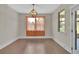 Dining area featuring hardwood floors, stylish lighting, and natural light at 145 Meadow Branch Ln, Dallas, GA 30157