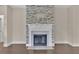 Stone fireplace with white mantel in a living room at 145 Meadow Branch Ln, Dallas, GA 30157
