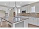 Spacious kitchen featuring granite countertops, stainless steel appliances, and pendant lighting at 145 Meadow Branch Ln, Dallas, GA 30157