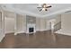 Hardwood floors, fireplace, and staircase in a bright and open living room area at 145 Meadow Branch Ln, Dallas, GA 30157