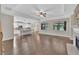 Spacious open-concept living space with hardwood floors, fireplace, and open access to the kitchen at 145 Meadow Branch Ln, Dallas, GA 30157