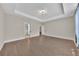 Spacious main bedroom featuring hardwood floors, tray ceiling, and neutral paint throughout at 145 Meadow Branch Ln, Dallas, GA 30157