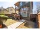 Backyard featuring a wooden fence, exterior stairs, and a view of the home's architecture at 1880 Eastfield St, Decatur, GA 30032