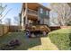Expansive backyard featuring a two-story home with a deck and a well-maintained lawn at 1880 Eastfield St, Decatur, GA 30032
