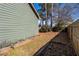 Backyard with a privacy fence, garden beds, and mature plants at 1880 Eastfield St, Decatur, GA 30032
