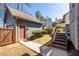 View of the backyard with the garage and stairway to the deck at 1880 Eastfield St, Decatur, GA 30032