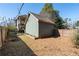 Backyard showing the side of the garage and the rear of the two-story house at 1880 Eastfield St, Decatur, GA 30032