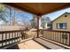 A balcony with a wood railing and view of neighboring houses at 1880 Eastfield St, Decatur, GA 30032