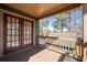 A balcony with wood railing and multiple windows at 1880 Eastfield St, Decatur, GA 30032