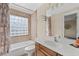 Bathroom featuring a bathtub, shower, and vanity at 1880 Eastfield St, Decatur, GA 30032