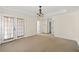 Bedroom featuring neutral carpeting, a decorative light fixture, and access to the exterior at 1880 Eastfield St, Decatur, GA 30032