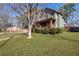 Well-maintained two-story home with lush green lawn and mature trees at 1880 Eastfield St, Decatur, GA 30032