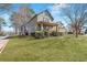 A well-maintained lawn complements the charming two-story home with a cozy covered front porch at 1880 Eastfield St, Decatur, GA 30032