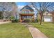 Classic two-story home with a landscaped yard and inviting front porch provides timeless appeal at 1880 Eastfield St, Decatur, GA 30032