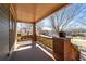 The covered front porch features a swing, wooden railing, and brick columns, perfect for enjoying the outdoors at 1880 Eastfield St, Decatur, GA 30032