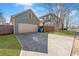 Detached garage featuring a concrete driveway and fenced yard at 1880 Eastfield St, Decatur, GA 30032