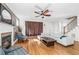 Bright living room with a cozy fireplace and an open floor plan with hardwood floors at 1880 Eastfield St, Decatur, GA 30032
