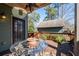 Inviting porch area showcasing a glass table with a cozy seating arrangement at 1880 Eastfield St, Decatur, GA 30032