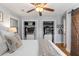 Bedroom featuring hardwood floors, closet organizers and ceiling fan at 2919 Mount Olive Dr, Decatur, GA 30033