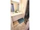 Bathroom with double sink vanity, white cabinets and framed mirror at 7157 Gladstone Cir, Stonecrest, GA 30038