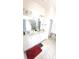 Bright bathroom with double vanity, tile floors and oversized mirror at 7157 Gladstone Cir, Stonecrest, GA 30038