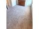 Bedroom with neutral carpet and wooden dresser at 7157 Gladstone Cir, Stonecrest, GA 30038