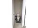 Neat half bathroom with tiled floors, toilet, and silver trash can at 7157 Gladstone Cir, Stonecrest, GA 30038