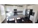 Modern kitchen with white cabinets, stainless steel appliances, and a granite-topped island at 7157 Gladstone Cir, Stonecrest, GA 30038