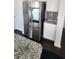 Modern kitchen featuring stainless steel refrigerator and granite countertops at 7157 Gladstone Cir, Stonecrest, GA 30038
