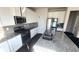 Bright kitchen features granite counters, stainless steel appliances and white cabinets at 7157 Gladstone Cir, Stonecrest, GA 30038