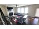 Inviting living room with a fireplace, large windows, and a comfortable seating arrangement at 7157 Gladstone Cir, Stonecrest, GA 30038