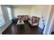 Cozy living room bathed in natural light, hardwood floors, and sophisticated furnishings at 7157 Gladstone Cir, Stonecrest, GA 30038