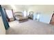 Spacious main bedroom with neutral carpet and furniture at 7157 Gladstone Cir, Stonecrest, GA 30038