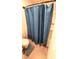 Bathroom shower with a teal shower curtain at 7157 Gladstone Cir, Stonecrest, GA 30038