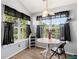Bright breakfast nook with large windows and a view of the backyard at 7235 Magnolia Ln, Fairburn, GA 30213